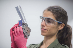 Federica Coppari holding an x-ray diffraction image plate