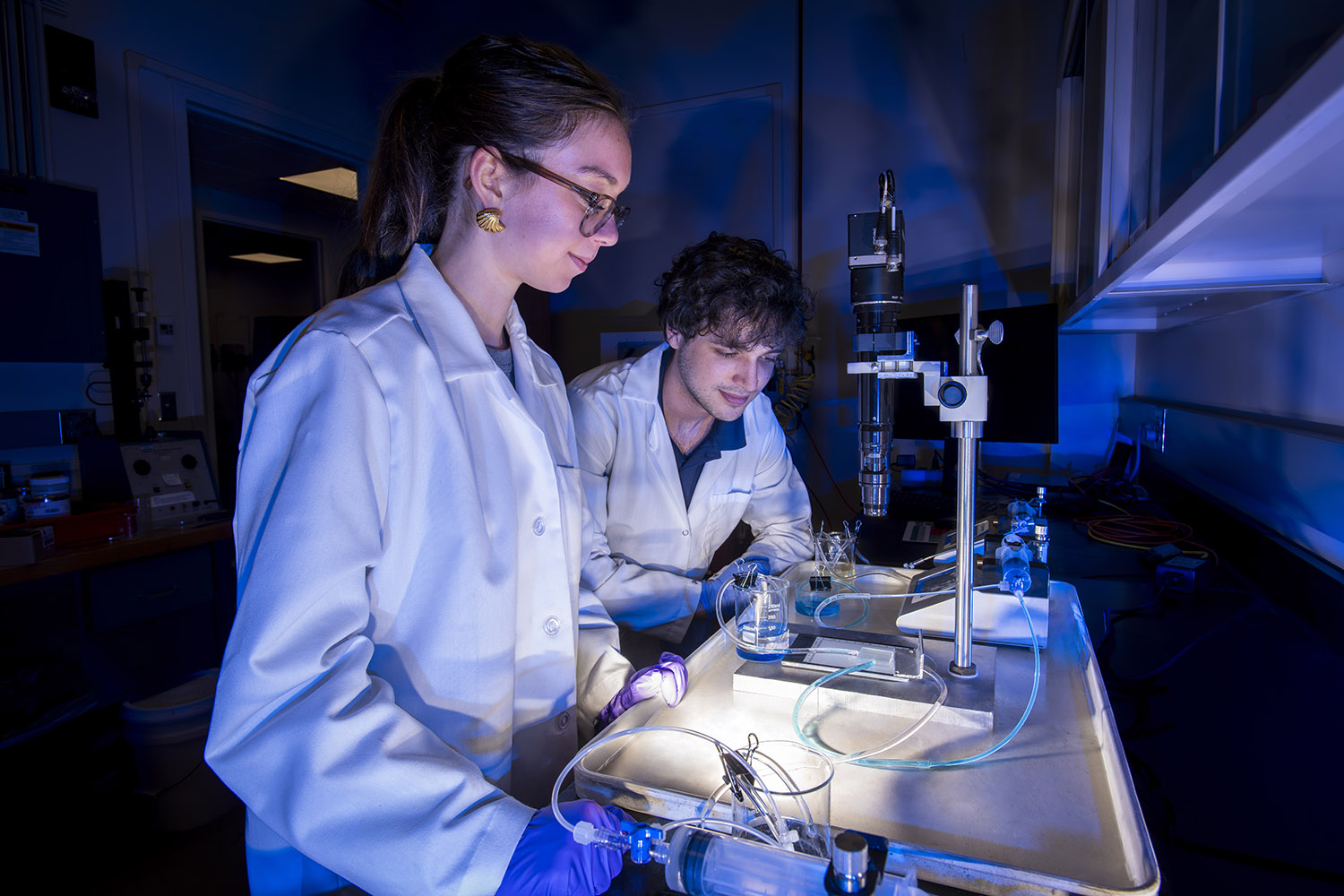 Two students in a laboratory.