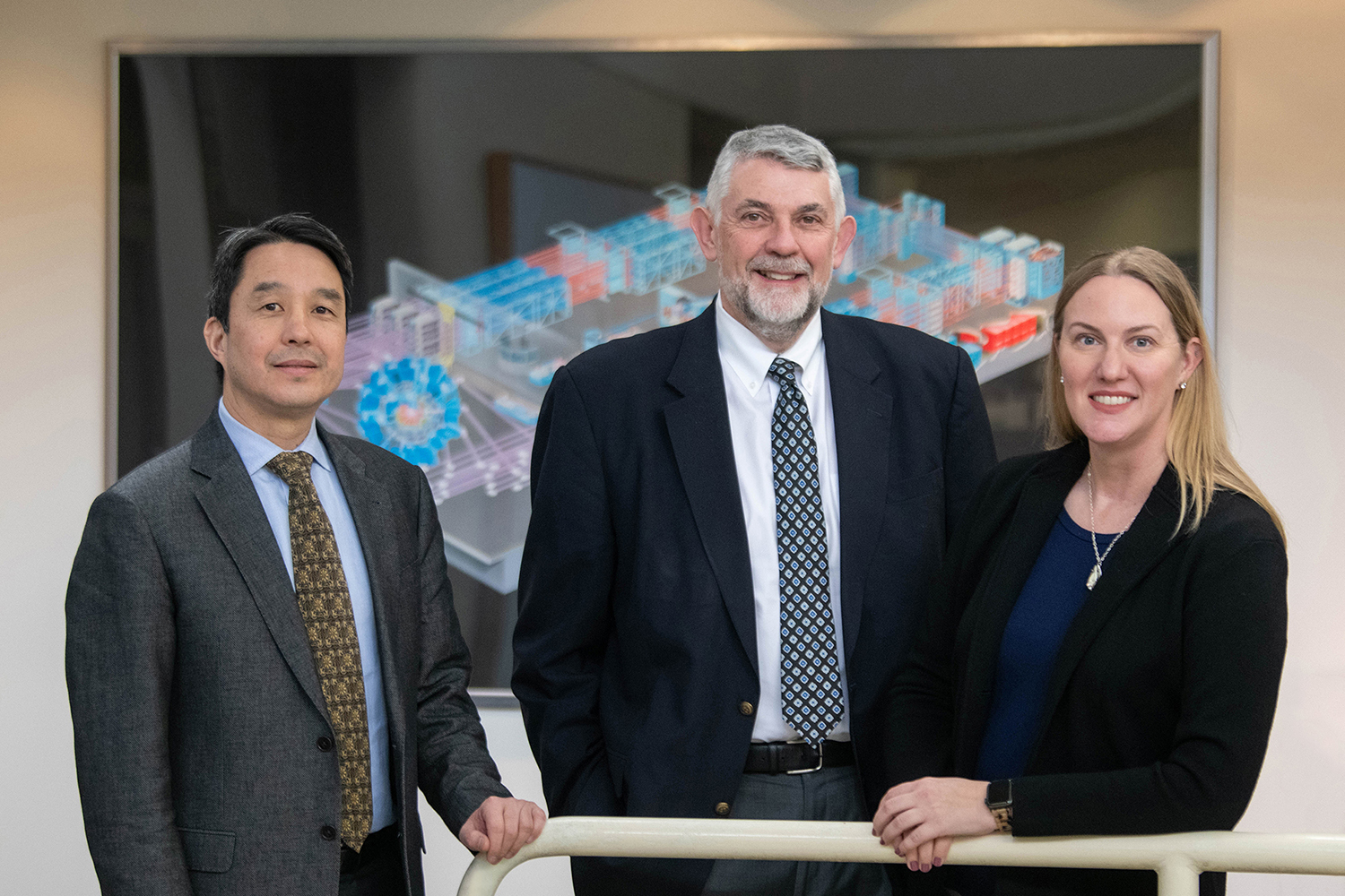 Scott Hsu, Chris Deeney, and Sarah Nelson posing for a picture.