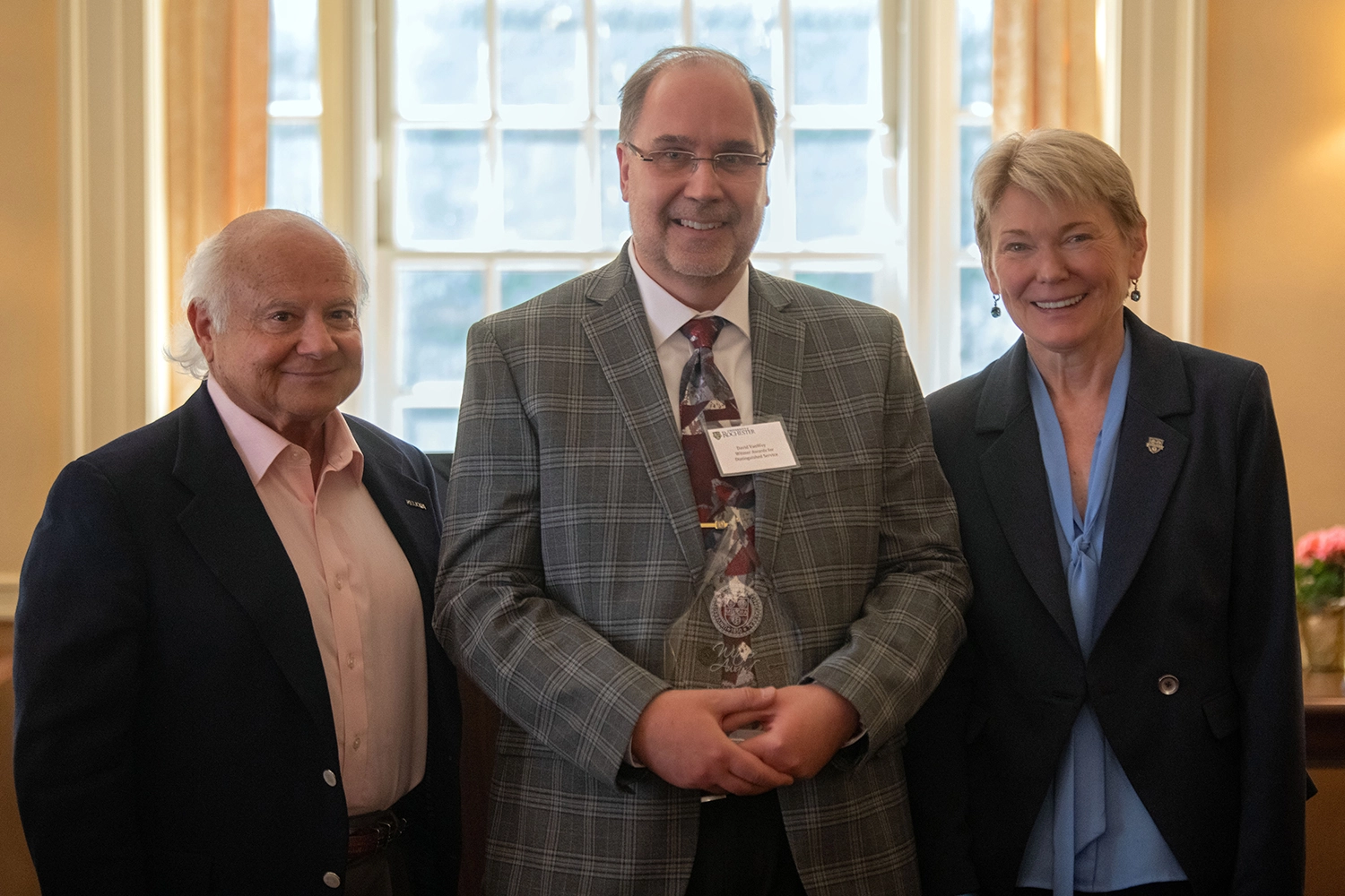 David VanWey being awarded the University of Rochester Witmer Award for Distinguished Service on Wednesday, June 8, 2023. Larry Kessler on left, David VanWey in center, and Sarah Mangelsdorf on right.