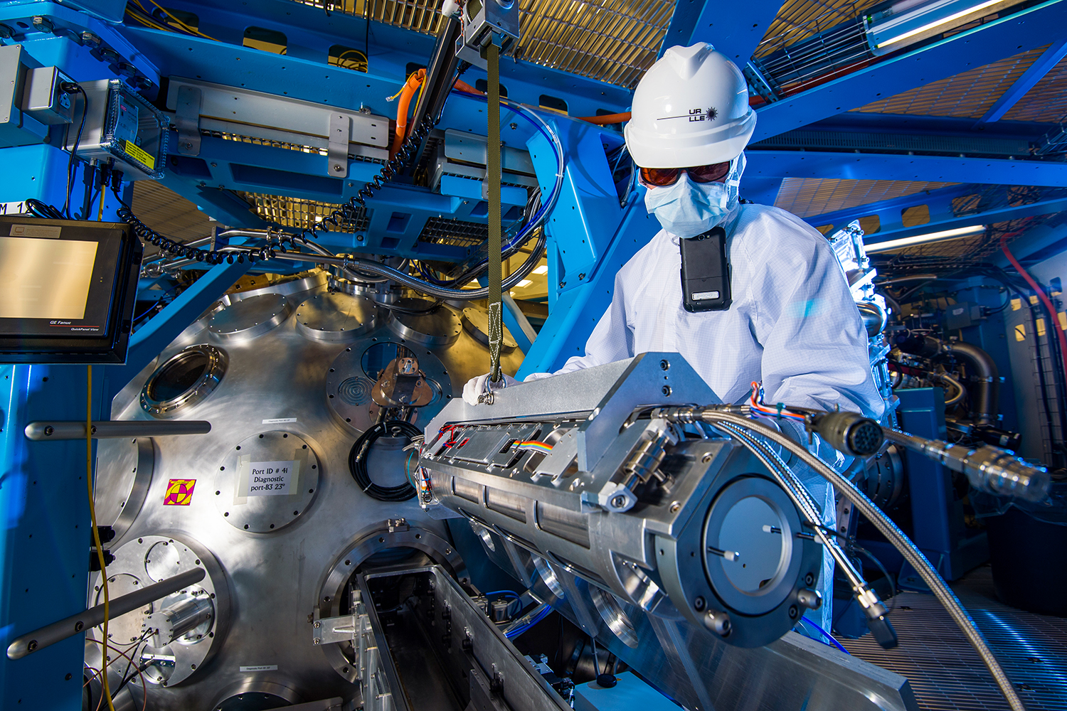 Technician moving diagnostic outside of the target chamber inside of the OMEGA EP Laser System.