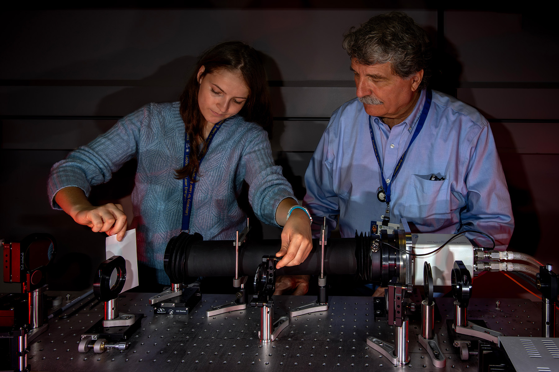 Student working in a laboratory with an advisor