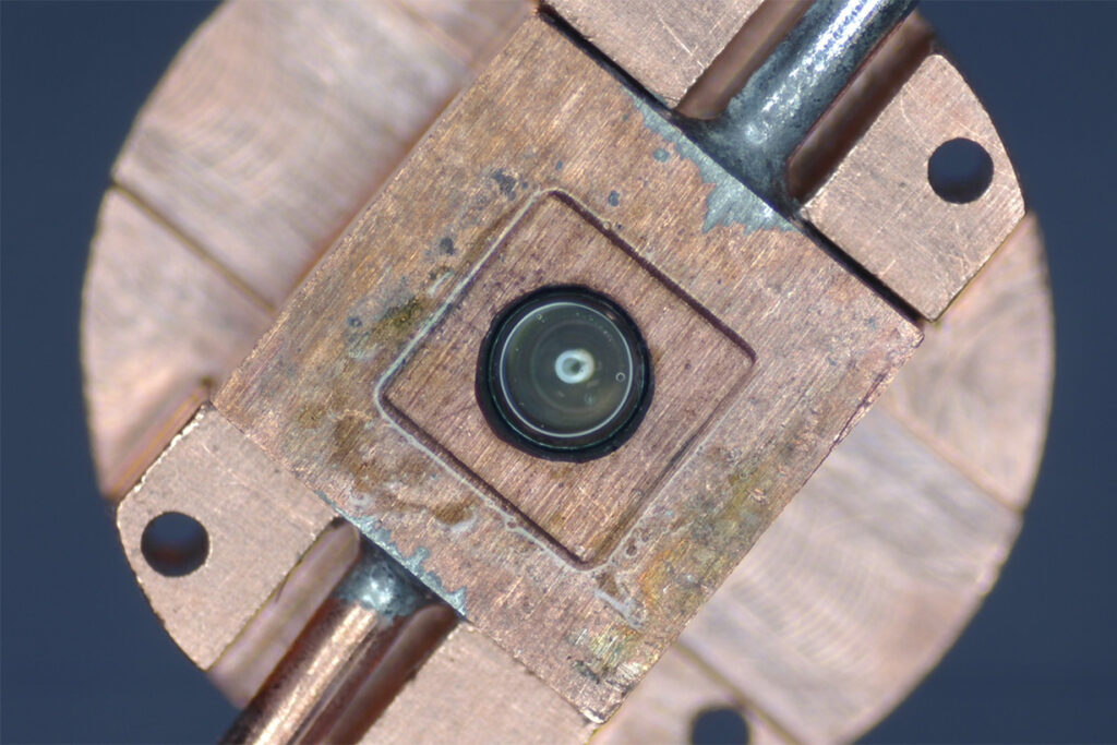 Close up of a circular target assembly with a square inset.