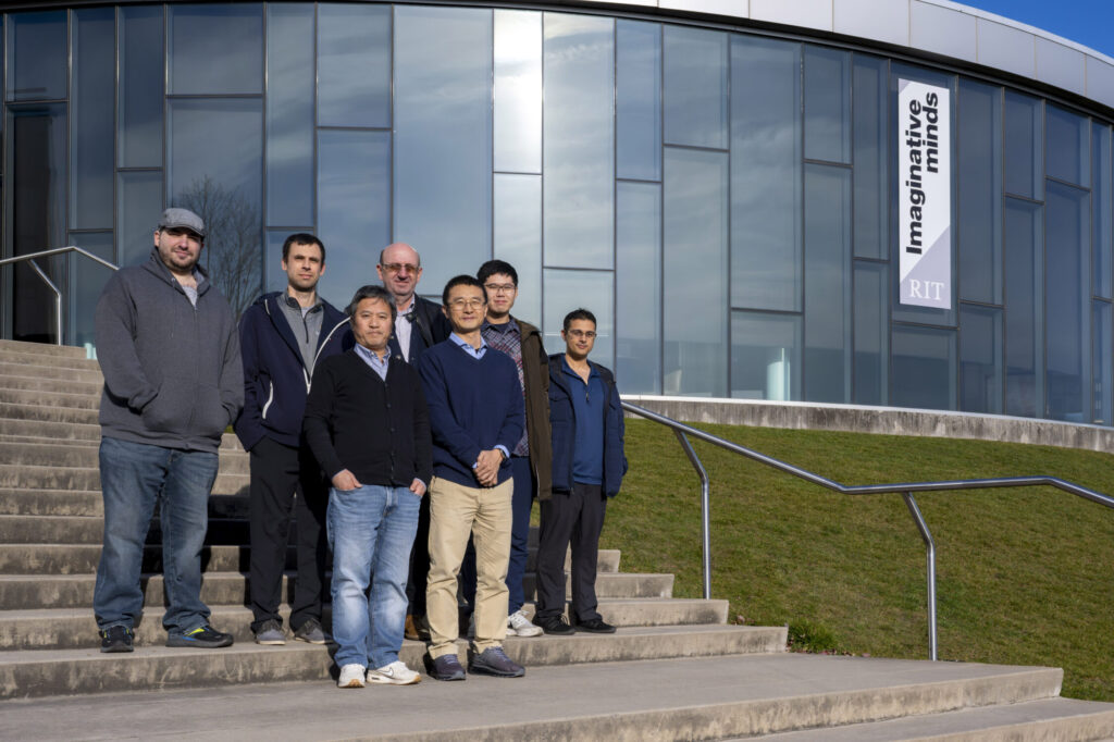 HEDP Theory Group and RIT Group standing in front of Innovation Hall at the Rochester Institute of Technology.