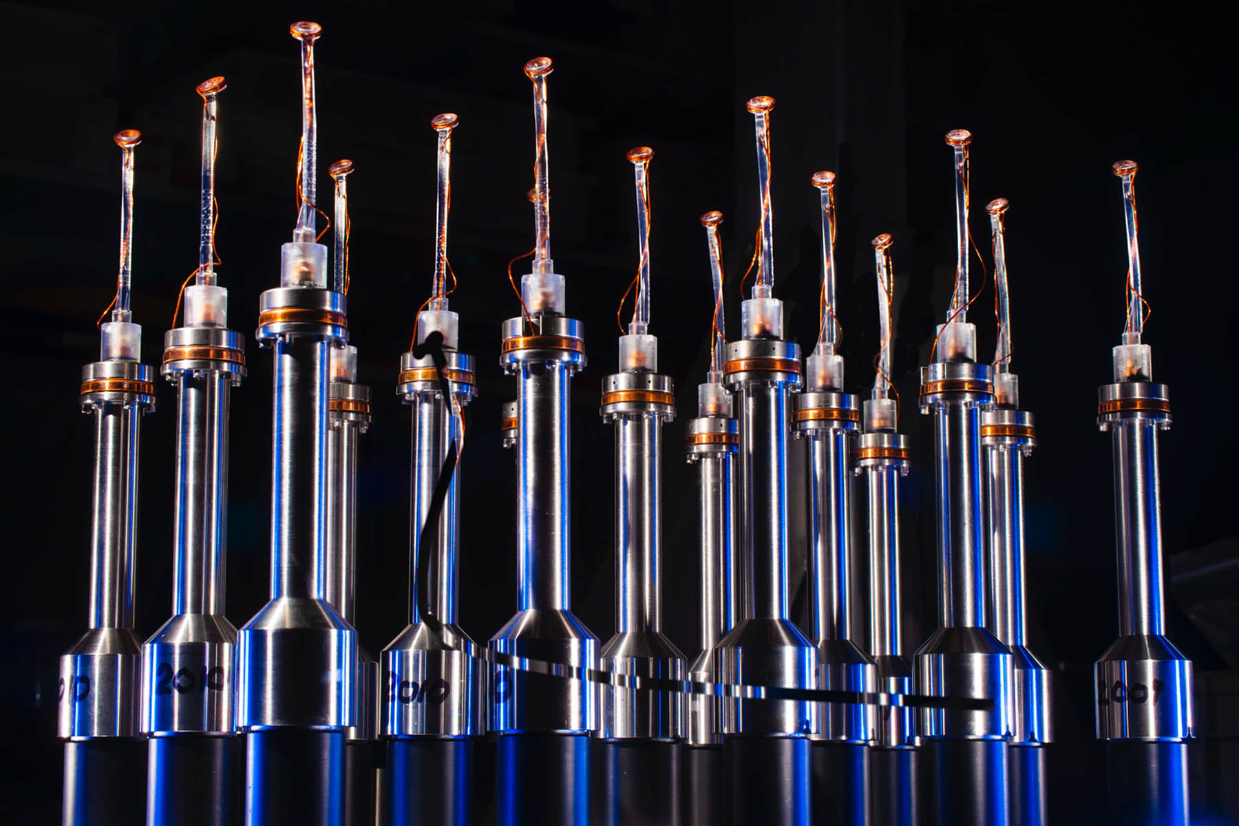 Several targets lined up in a row against a black background.