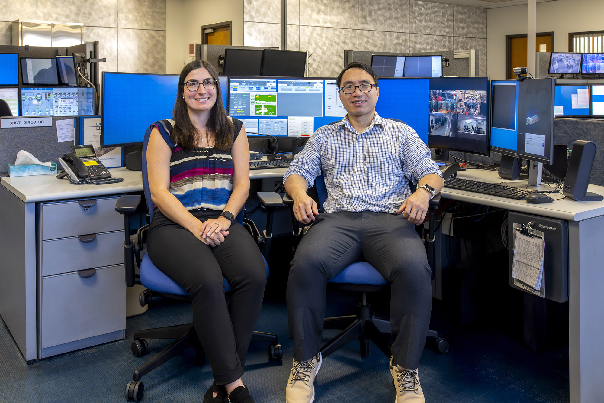 Kristen Churnetski and Jack Woo in the OMEGA Control Room at the Laboratory for Laser Energetics.