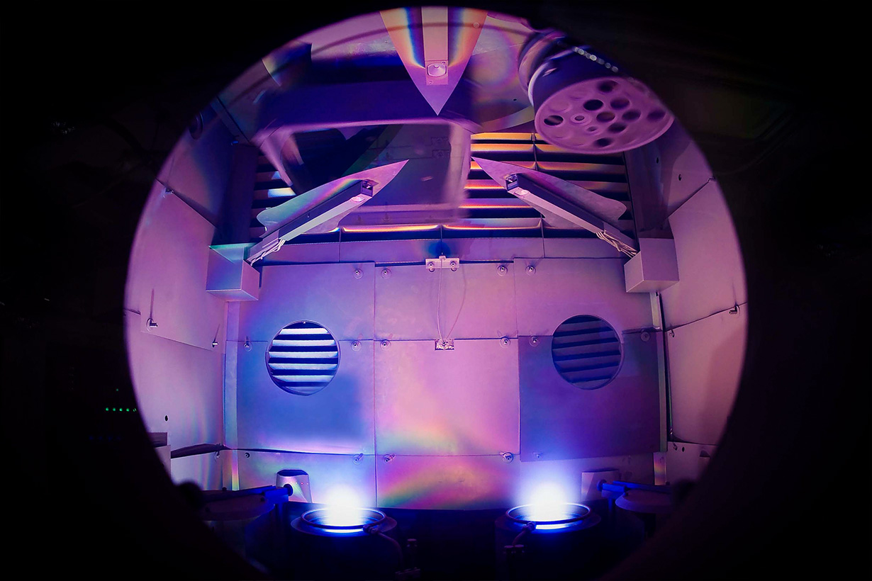 View through a window in OMAN's 72-inch coater.