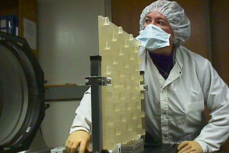 A photo of Hope D’Alessandro, electronics technician, preparing a NIF deformable mirror substrate for surface figure testing.