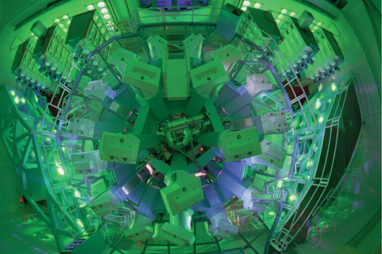 Photo taken from above the OMEGA 60-beam target bay. The components are bathed in green light.
