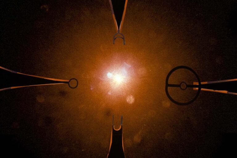 Photo of a taget shot. Images of four different coil shapes are superimposed on the background image.