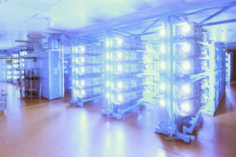 A photo of several clusters of beamlines in the OMEGA Laser System firing.