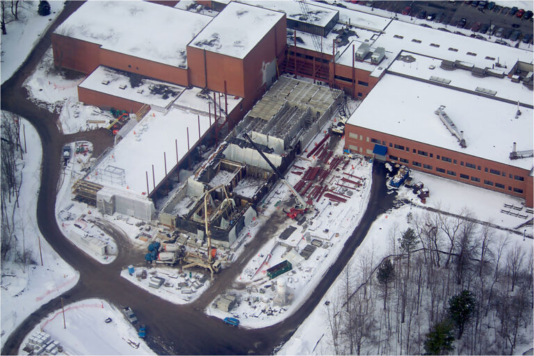 Top view of a building undergoing construction during winter.