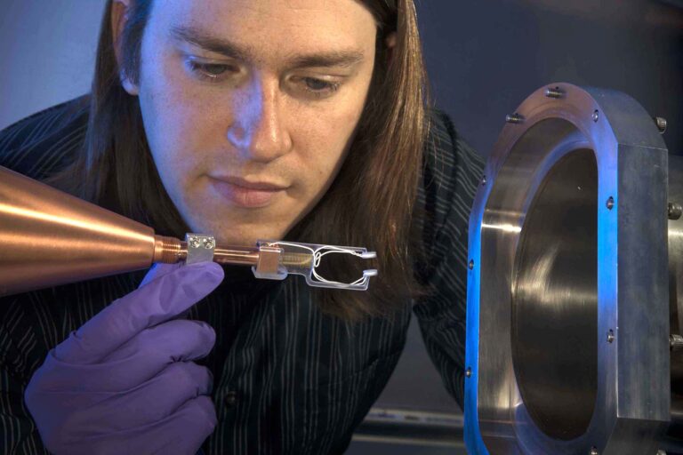 A person working on lab equipment.