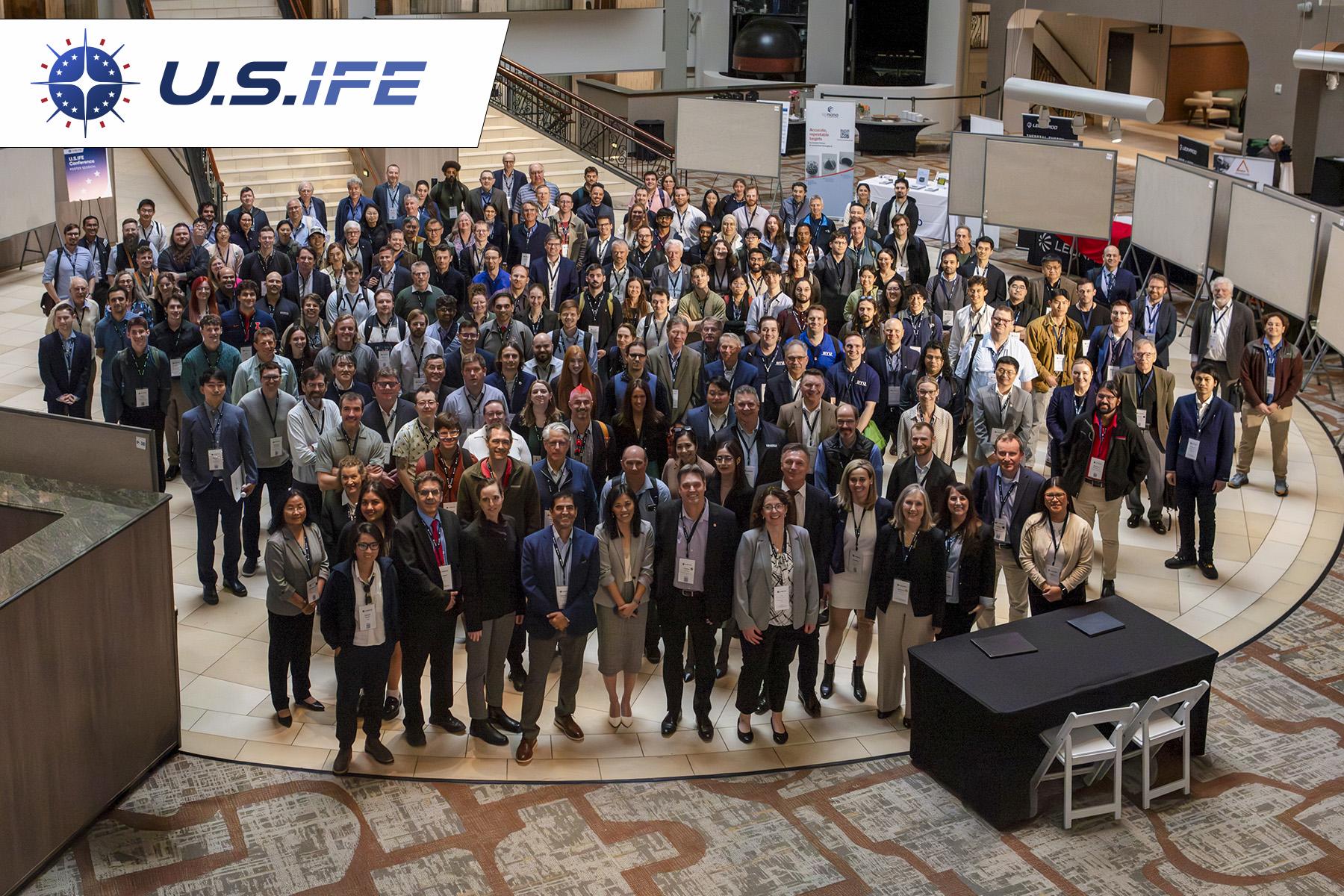 The US IFE logo and a group photograph of conference attendees.
