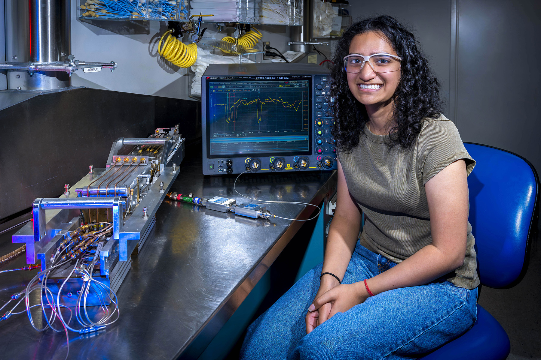 Portrait photo of Simran Mohile working in the LLE OMEGA EP Workshop.