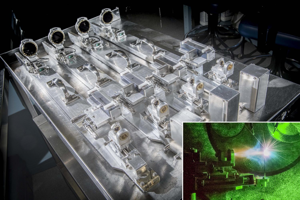 Monochromatic Talbot–Lau x-ray deflectometer in background with inset photo of Talbot–Lau x-ray deflectometer during shot 34890.